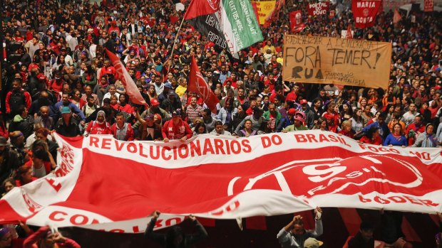 Thousands of demonstrators march during a protest organised by the Movement of the Roofless Workers, against Brazil's acting President Michel Temer, and in support of suspended President Dilma Rousseff, in Sao Paulo, on Thursday.
