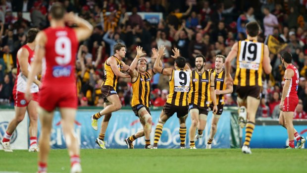 SYDNEY, AUSTRALIA - AUGUST 25:  Brad Sewell of the Hawks celebrates with team mates after kicking the final goal during the round 22 AFL match between the Sydney Swans and the Hawthorn Hawks at Sydney Cricket Ground on August 25, 2012 in Sydney, Australia.  (Photo by Matt King/Getty Images)