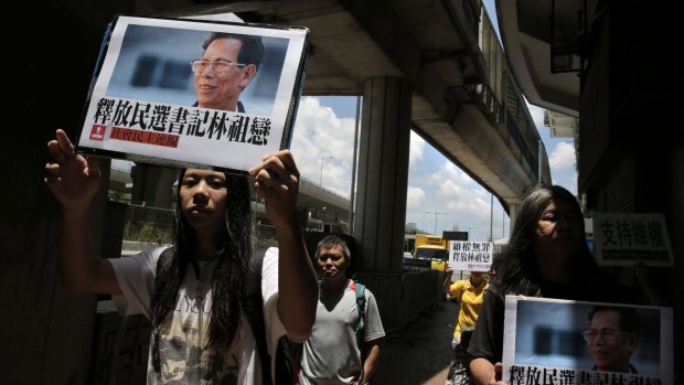 Protesters in Hong Kong deplore the detention of Wukan mayor Lin Zuluan.