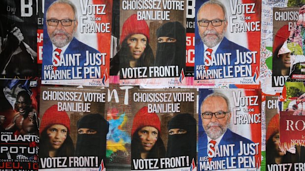 Posters for far right anti-immigration party National Front state in Paris earlier this month.