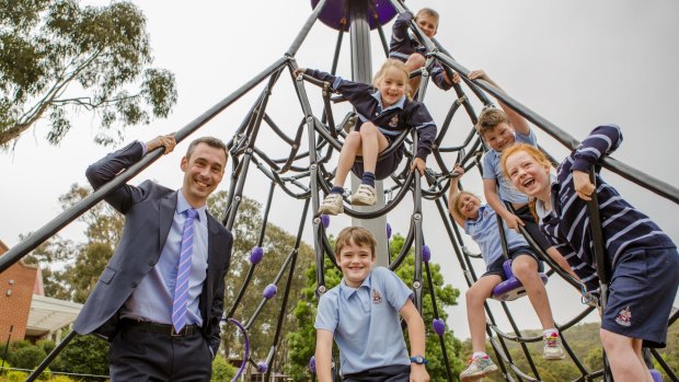 Principal Justin Garrick, pictured with year-two-students, announced on Tuesday that Canberra Grammar will become co-educational.