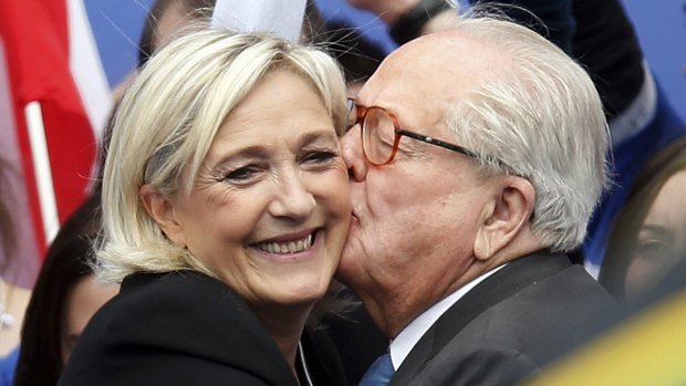 Jean-Marie Le Pen (R), France's National Front political party founder, embraces his daughter Marine Le Pen, National Front political party leader, in happier times.