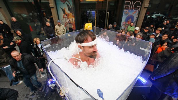  Wim Hof standing in ice outside the Rubin Museum of Art in New York in 2008, during a successful attempt to break his previous world record for immersion in an outdoor ice bath. He stayed in the ice bath for one hour and 12 minutes.