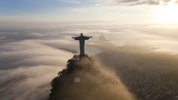 The statue of Christ the Redeemer stands like a guardian angel over the city.