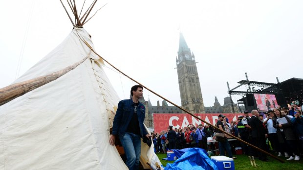 Justin Trudeau leaves a teepee on Parliament Hill after meeting with indigenous activists on Friday.