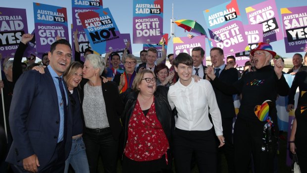Same-sex marriage campaigners outside Parliament House on Thursday.