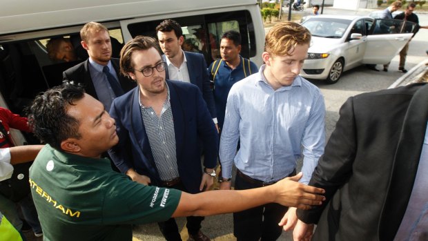 Nick Kelly, centre left, and Thomas Whitworth, centre right, arrive at court on Thursday. 