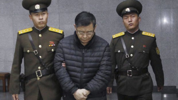 Hard labour for life: Canadian pastor Hyeon Soo Lim is escorted to his sentencing in Pyongyang on Wednesday.