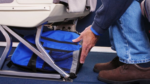 If your bag won't fit under a plane seat, you'll have to check it in.