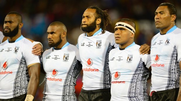 Dual heritage: Lote Tuqiri with Fijian players standing for their anthem during the rugby league Test against Samoa at Penrith in 2014.