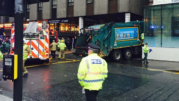 The garbage truck appeared to have run out of control along a pavement in the city centre shopping area.