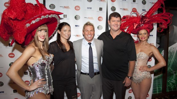 Shane Warne with Erica Baxter and James Packer at one of his charity's poker events at Crown Casino.