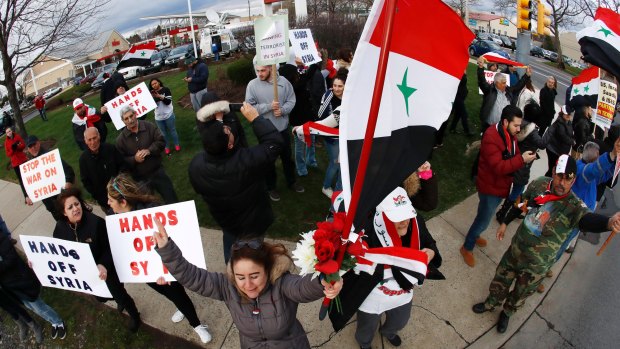 A crowd chants during a rally in opposition to the US air strikes in Allentown, Pennsylvania, one of the US's largest Syrian communities.