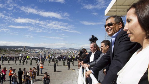 Ecuador's President Rafael Correa (2nd ring) looks at preparations at the Bicentenario Park, where Pope Francis will hold a mass during his Quito visit.