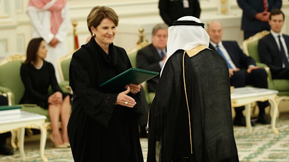 Lockheed Martin chief executive Marillyn Hewson shakes hands with a Saudi dignitary. The defence firm signed a $US6 billion letter of intent to build 150 Black Hawk helicopters in the kingdom.