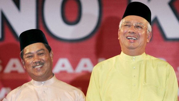 Malaysian Prime Minister Najib Razak (right) axed his deputy Muhyiddin Yassin share a lighter moment in 2009.