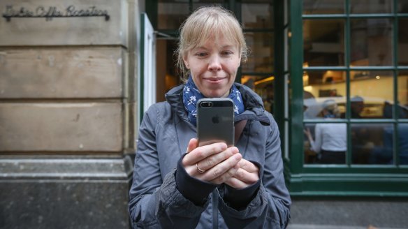 Top online food reviewer Louisa Wright poses for a photo outside Dukes Coffee Roasters – she gave it five stars out of five.
