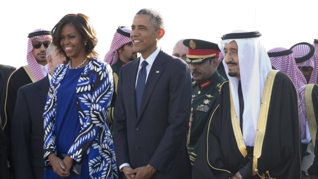 Causing a stir by not wearing a headscarf: US first lady Michelle Obama with President Barack Obama stand with new Saudi King Salman bin Abdulaziz after arriving on Air Force One at King Khalid International Airport, in Riyadh, Saudi Arabia.
