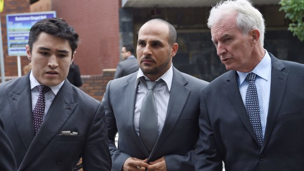Charges dropped: Hazem El Masri, centre, with lawyers Bryan Wrench, left, and Chris Murphy at Bankstown Local Court.