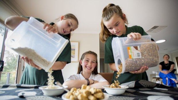 
Mother Fiona Loaney with daughter (middle) Emma, 10, and friends Elissa Gallop, 10 and Zoe Sherrad, 10, avoid getting hangry by having breakfast.