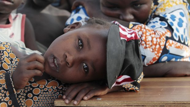 A girl displaced as a result of Boko Haram attack in the northeast region of Nigeria, rests her head on a desk at Maikohi secondary school camp for internally displaced persons (IDP) in Yola, Nigeria.