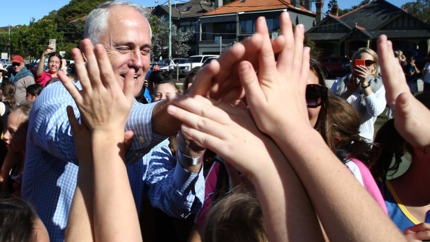 The Prime Minister greets young netballers at Waverley, Sydney on Saturday.