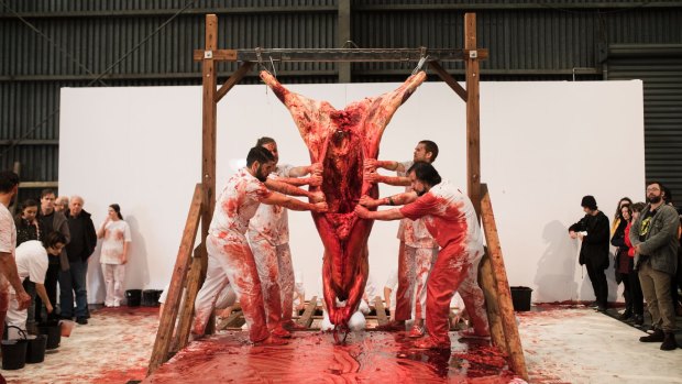 Hermann Nitsch and a team of performers staged their controversial 'action': it included a cow carcass and hundreds of litres of animal blood. 