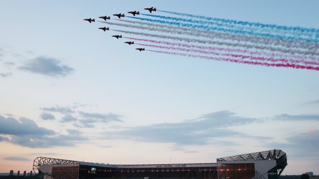 The Red Arrows fly over Celtic Park during the Opening Ceremony.