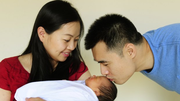 Liz and Colin Cheong, of Gungahlin, with their daughter Chelsea, who was born in a hurry on the side of the Gungahlin Drive Extension on Friday. 