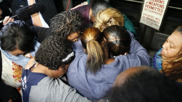 Supporters of the victims of former Oklahoma City police officer Daniel Holtzclaw pray after the verdicts were read for the charges against him at the Oklahoma County Courthouse.