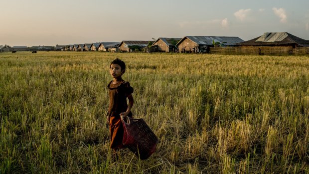 A girl near a camp full of Rohingya refugees on the edge of Sittwe.