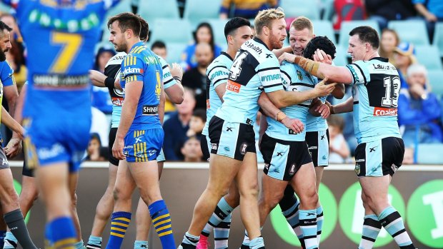 Finals bound: Sharks players celebrate a try by Michael Ennis during the round 25 win over the Parramatta Eels at Pirtek Stadium.