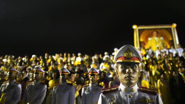 Thai military stand guard during celebrations to pay respect to Thailand's King Bhumibol Adulyadej on his birthday in 2012.