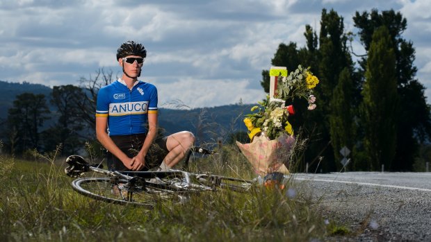 Canberra cyclist Lewis Brocklehurst visits the site of the accident that claimed the life of his idol, British endurance cyclist Mike Hall, on Friday. 