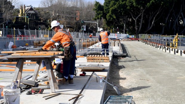 Construction workers at a stop for the light rail line on Wansey Road near Randwick Racecourse.