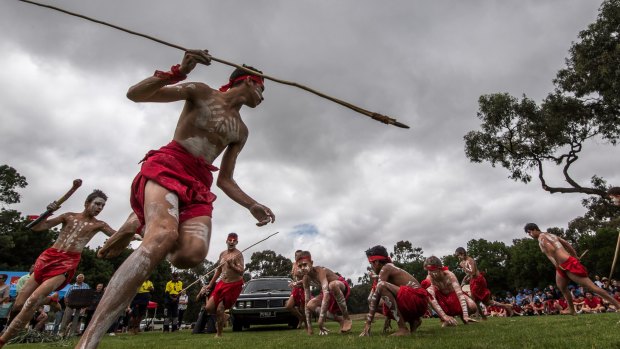 Children of the Tirkandi Inaburra dance group greet the hearse at Hay.