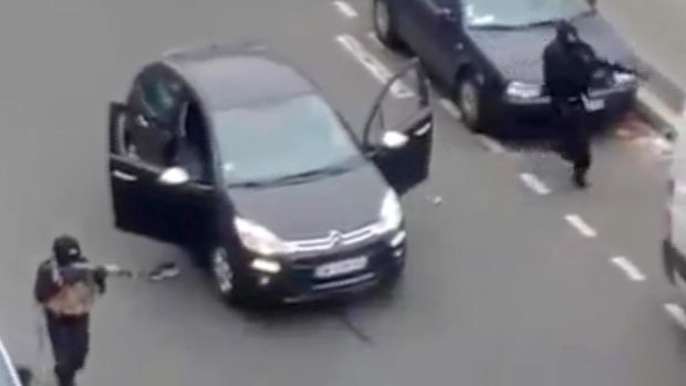 Gunmen outside the Paris offices of Charlie Hebdo. 