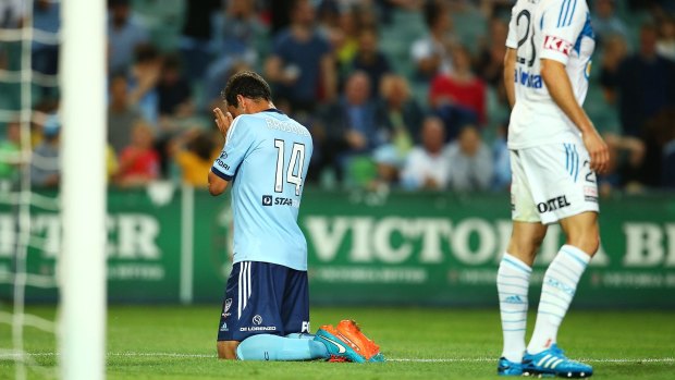 Sydney FC captain Alex Brosque reacts after missing a goal against Melbourne Victory on Saturday night.