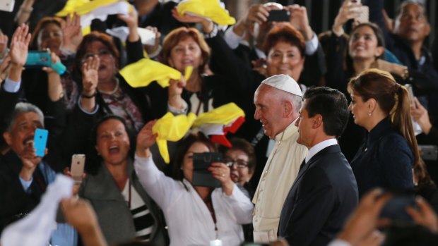 Cheering well-wishers greet Pope Francis in Mexico on Wednesday. 