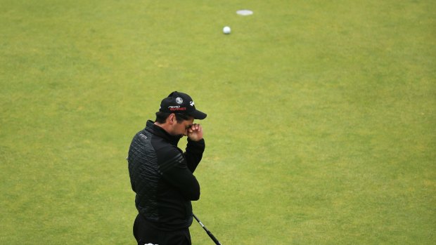 Anguish ... Jason Day of Australia leaves his final birdie attempt short at the 18th green to miss a chance at joining the playoff. 