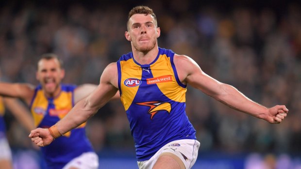 Shoe-in: Luke Shuey celebrates his extra-time goal to seal a thrilling elimination final win against Port Adelaide.