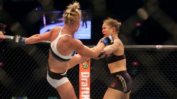 Ronda Rousey get a clobbering from Holly Holm. UFC boss says the sport will go underground if the Barnett continues to ban the 'cage'.