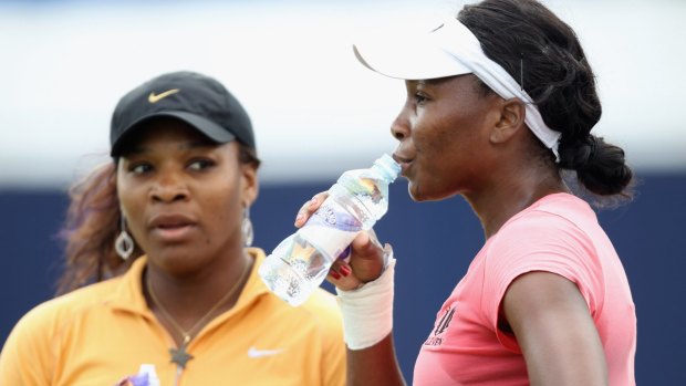 Serena and Venus Williams, pictured in 2011, may yet face each other at the Wimbledon final.