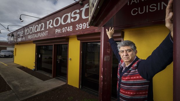 Dhananjay Mehra in front of his Werribee restaurant, which he says is being overrun by food trucks on the vacant lot next door. 