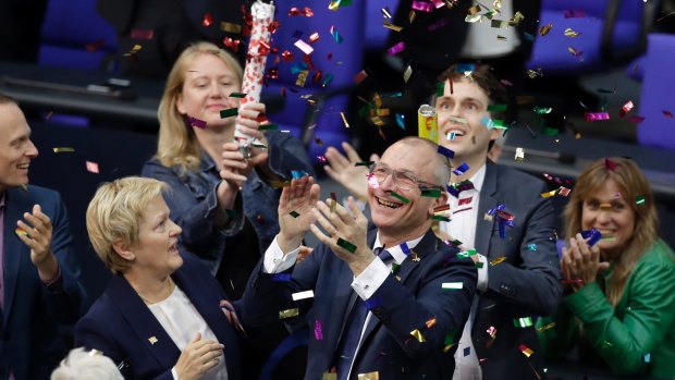 Green Party's gay rights activist Volker Beck, front right, and fellow faction members celebrate  after the German parliament  voted to legalise same-sex marriage.