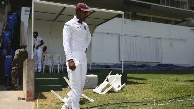 Woeful Windies: A forlorn West Indies captain Denesh Ramdin emerges from the pavilion after his team was comprehensively beaten in the second Test in Jamaica. 