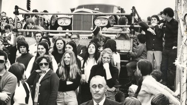 Robert Menzies watches a Carlton-Footscray match from his car on a special platform. 