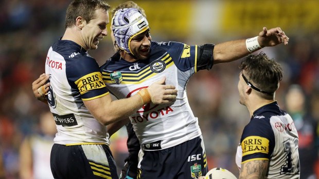 Show time: Johnathan Thurston and Michael Morgan congratulate Ethan Lowe after his try against the Panthers.
