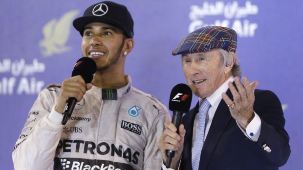 Mercedes driver Lewis Hamilton is interviewed by former F1 champion Sir Jackie Stewart on the podium in Bahrain.