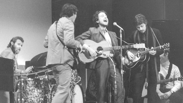 Bob Dylan performing with The Band at Carnegie Hall in January 1968. The house where they wrote and recorded many of their songs together is available for rent.